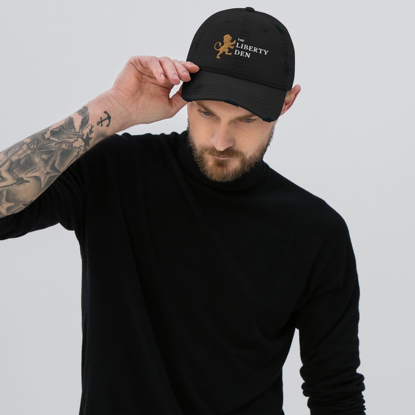 The Liberty Den Distressed Dad Hat (light logo)